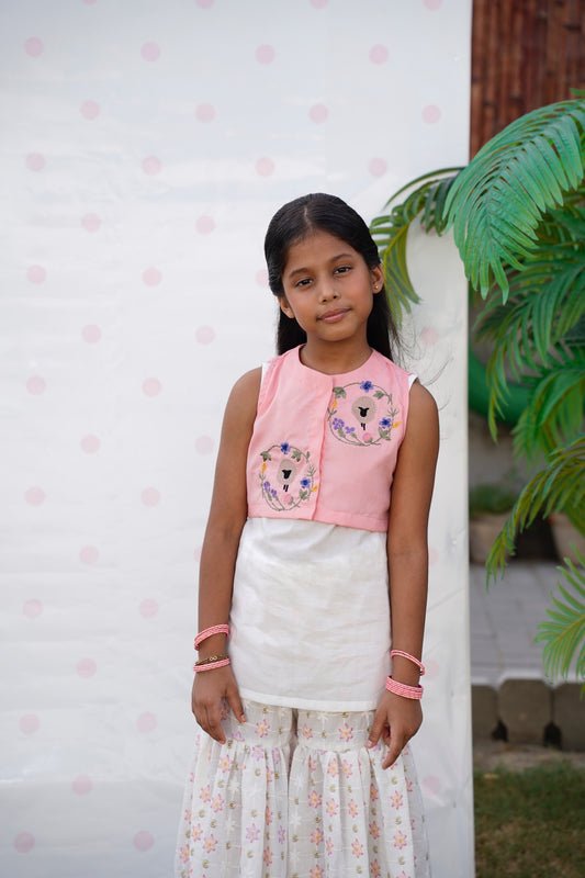 Full front, standing outdoors: "Blush pink embroidered cotton koti with floral chikankari gharara, full front view — SHAFAÉ Goatie Blush"