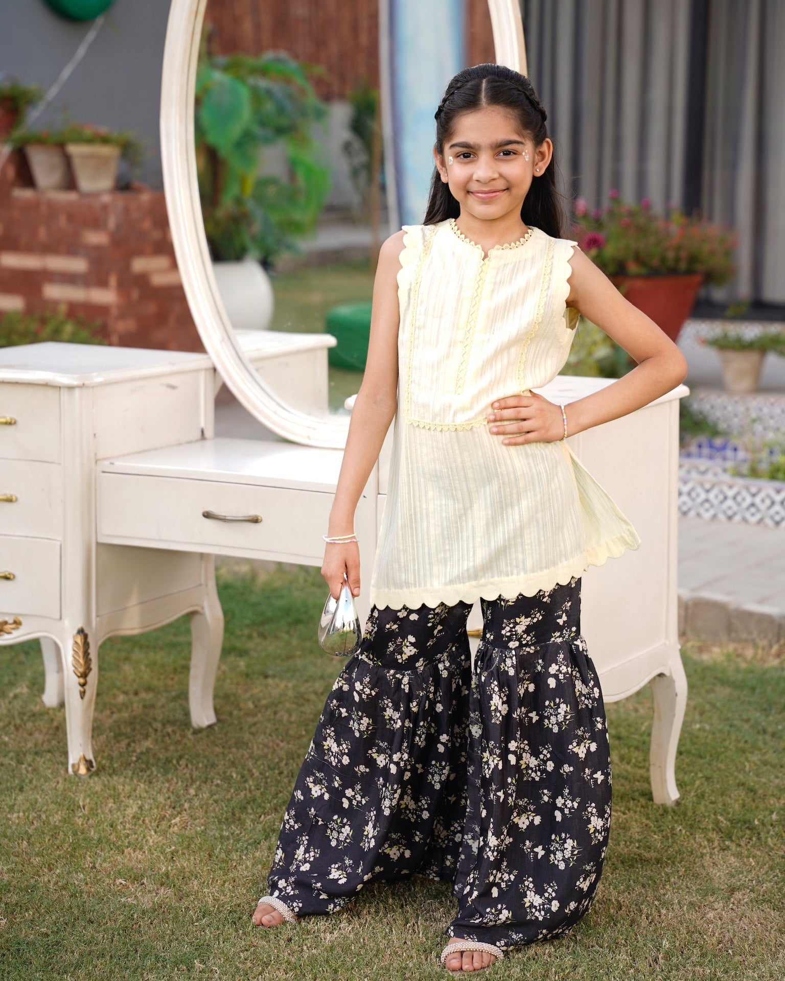 Full front, standing outdoors: "lemon lawn sleeveless shirt with dark floral printed gharara, full front view SHAFAÉ lemon Bloom"