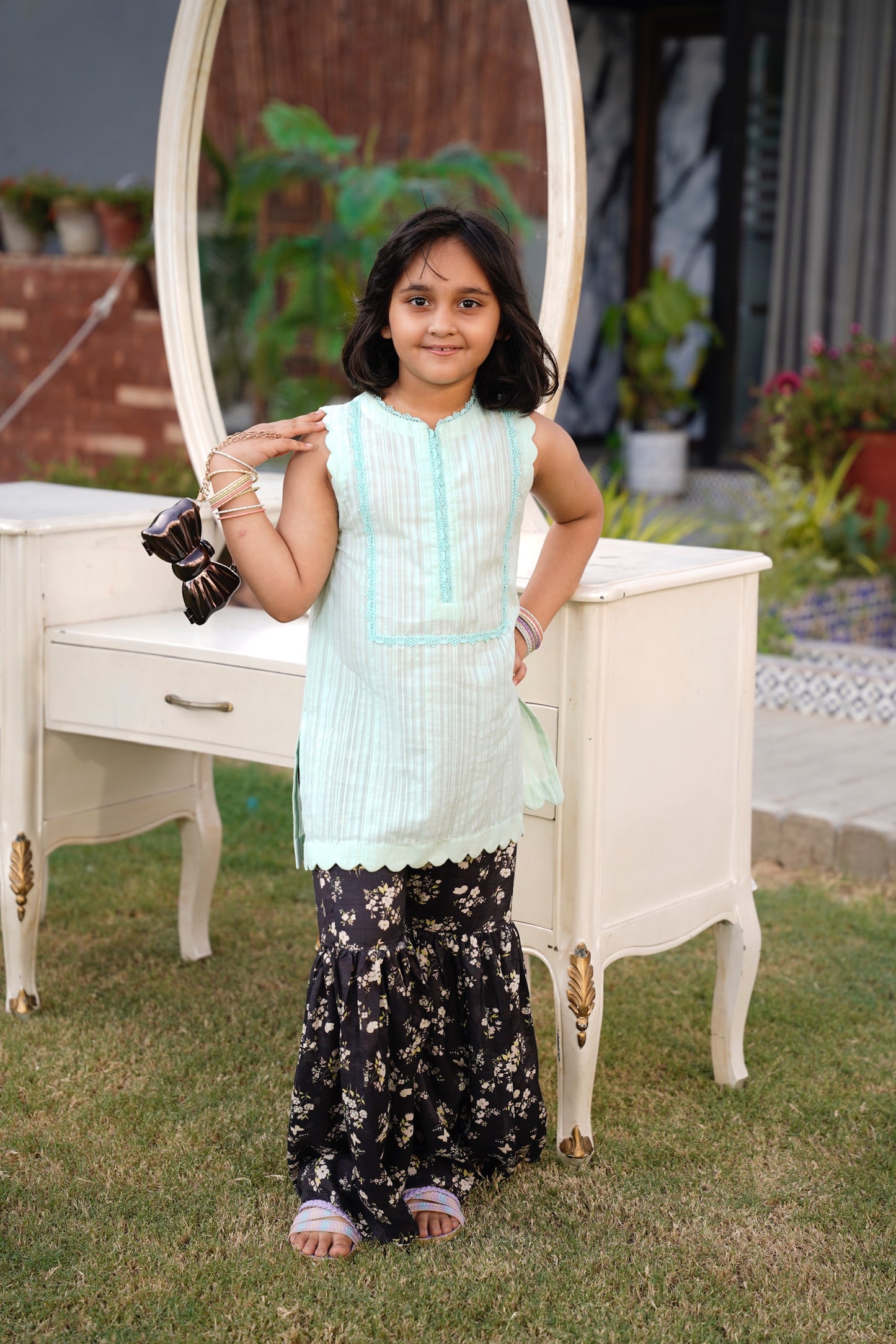 Full front, standing outdoors: "Mint lawn sleeveless shirt with dark floral printed gharara, full front view  SHAFAÉ Mint Bloom"