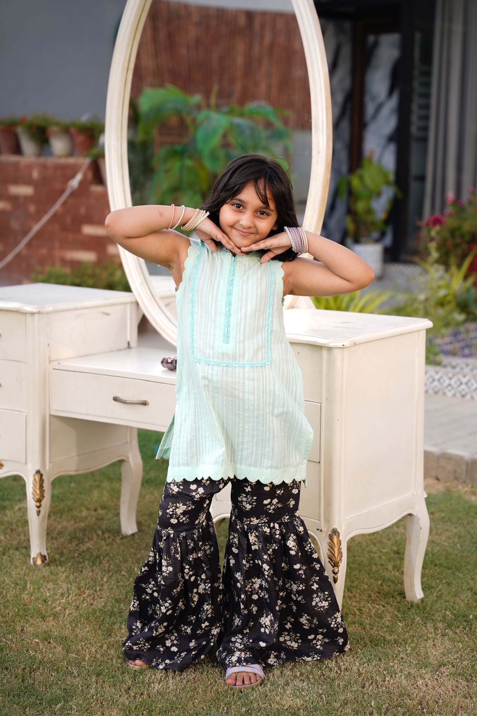 Full front, standing outdoors: "Mint lawn sleeveless shirt with dark floral printed gharara, full front view SHAFAÉ Mint Bloom"