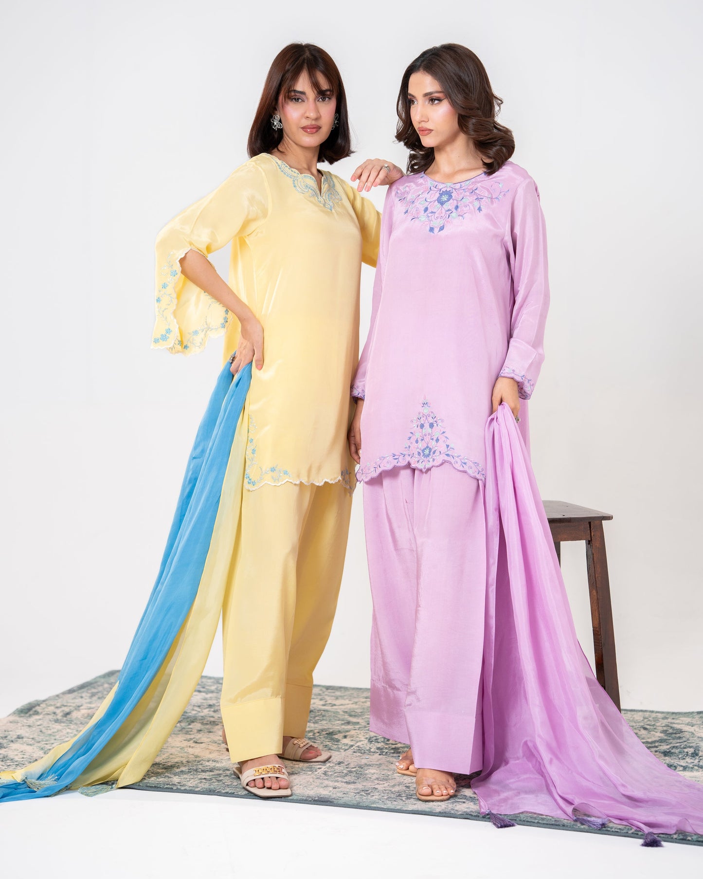 Two women wearing pastel-colored traditional outfits with shawls  embroided silk suit dress wth farshi shalwar and ombre dupatta Shafae