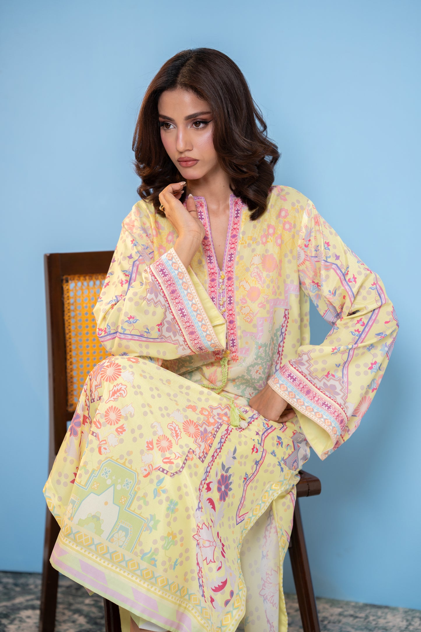 "Pastel yellow printed silk kaftan, seated front view  SHAFAÉ Sunlit Kaftan"
