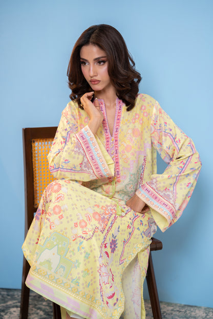 "Pastel yellow printed silk kaftan, seated front view  SHAFAÉ Sunlit Kaftan"