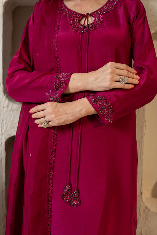 : "Close-up of sequin floral embroidery on magenta silk sleeve cuff SHAFAÉ Pink Hues"