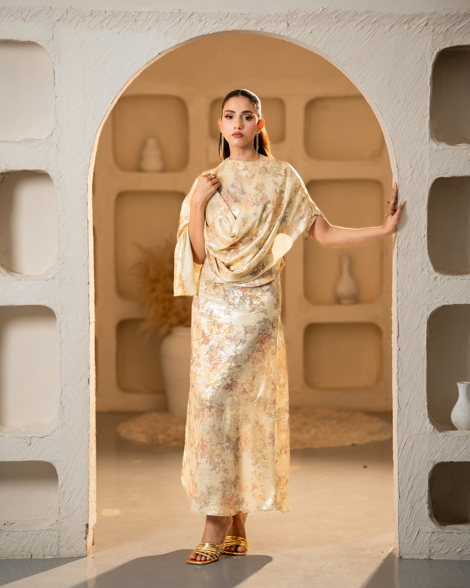  "Gold metallic satin silk set, profile pose with draped cape SHAFAÉ Gold Grace"